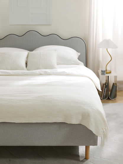 Romveil Upholstered Bed with Wavy Headboard